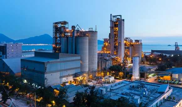 Industrial Processing Plant at night. Machine learning can help transform industrial processes